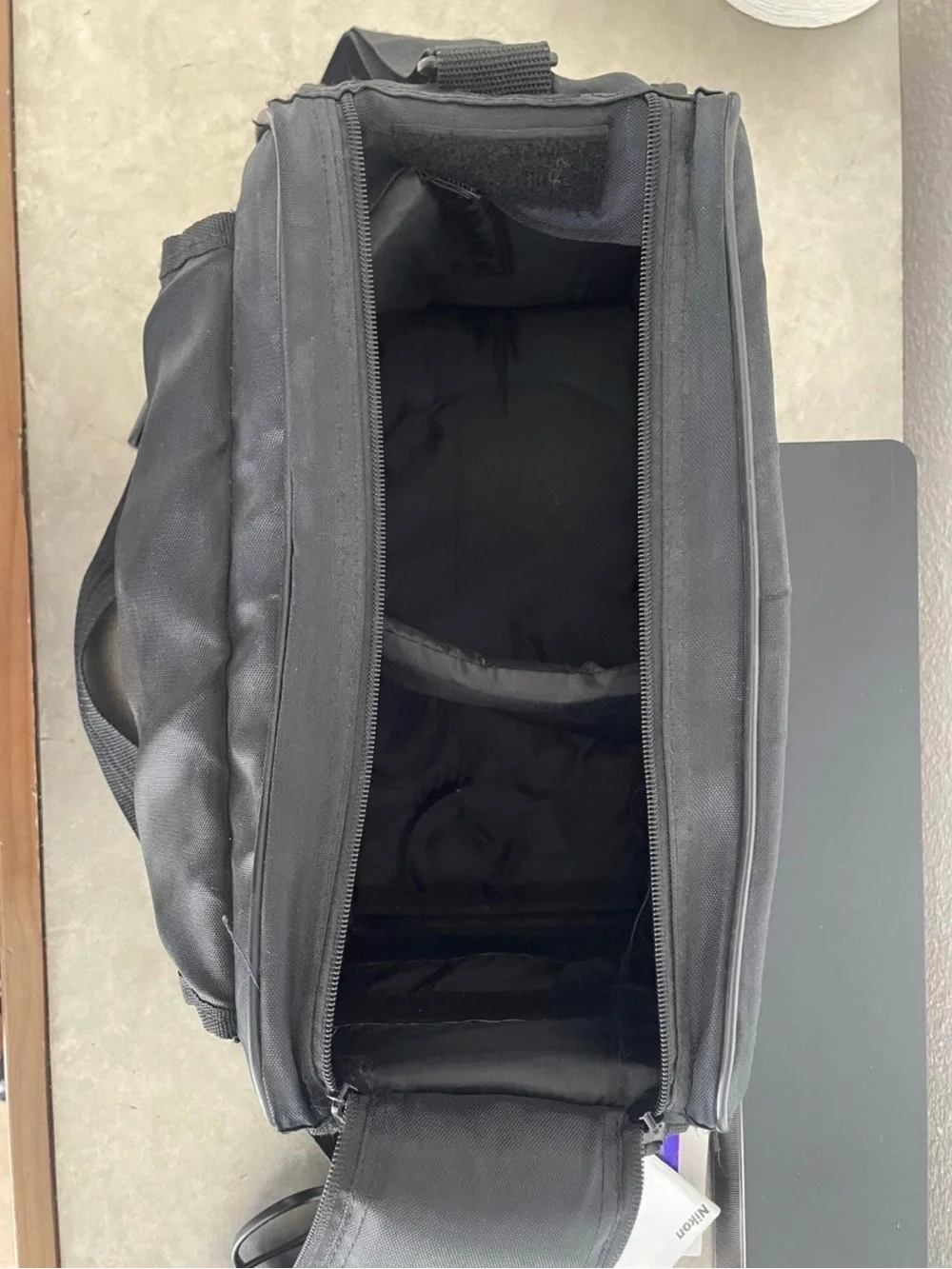 Nikon Black DSLR with Telephoto Zoom and Lens Hood